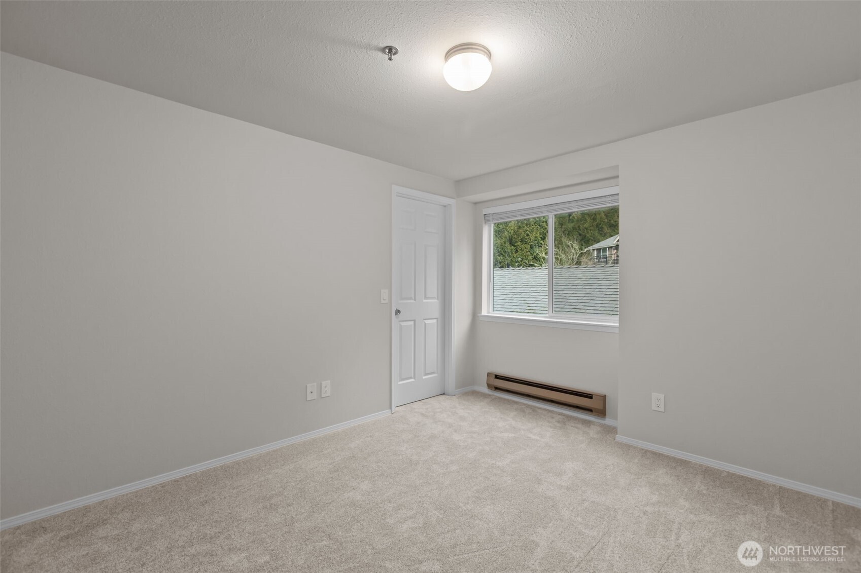 19404 Bothell Way Northeast, Unit B202 Bothell, WA 98011 - Photo 26 of 38 an empty room with windows