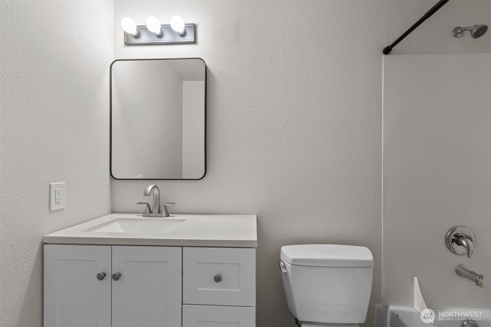 19404 Bothell Way Northeast, Unit B202 Bothell, WA 98011 - Photo 29 of 38 a bathroom with a toilet sink and mirror