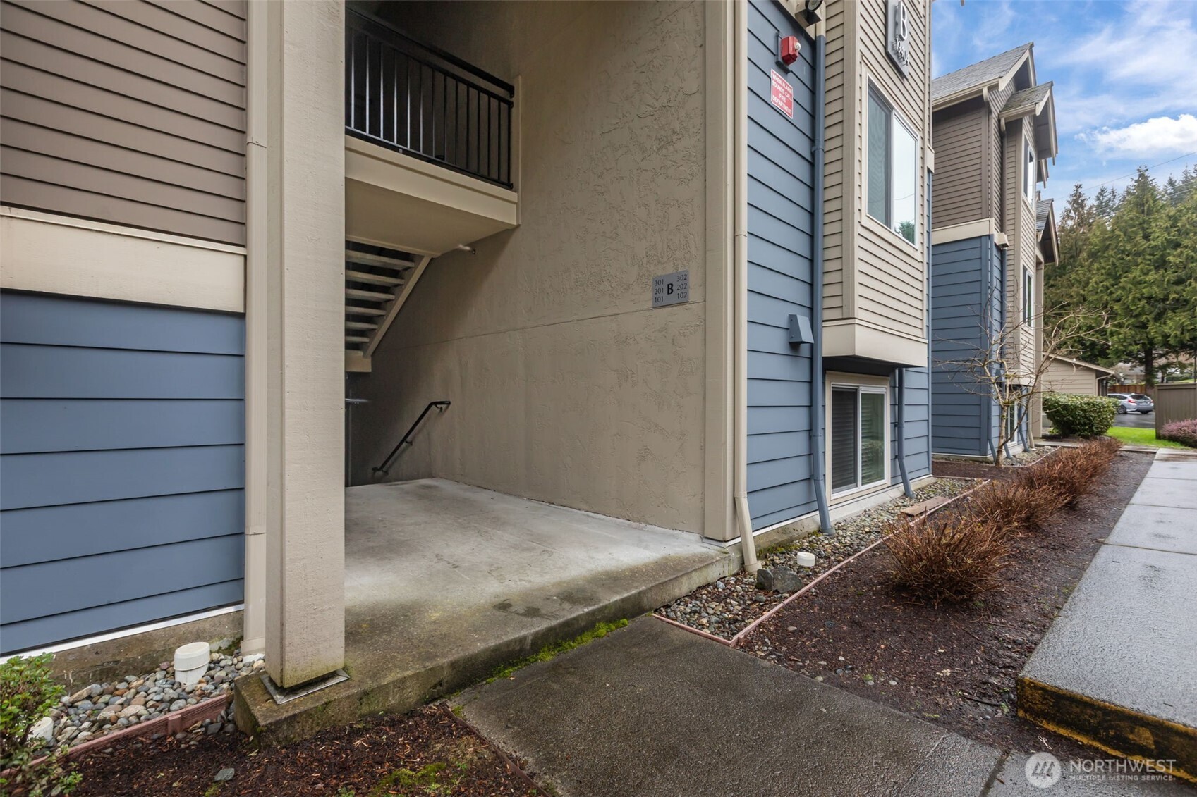 19404 Bothell Way Northeast, Unit B202 Bothell, WA 98011 - Photo 3 of 38 a view of a house with a door and wooden walls