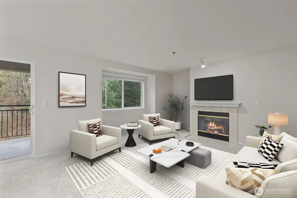 a living room with furniture fireplace and a window