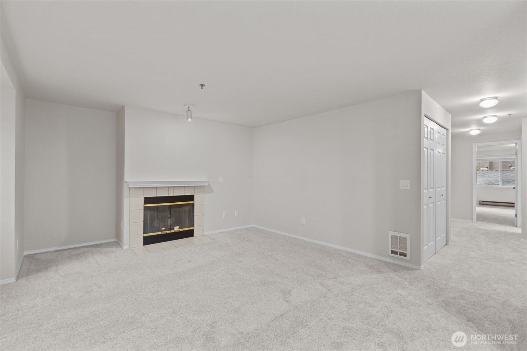 19404 Bothell Way Northeast, Unit B202 Bothell, WA 98011 - Photo 7 of 38 a view of empty room with a fireplace