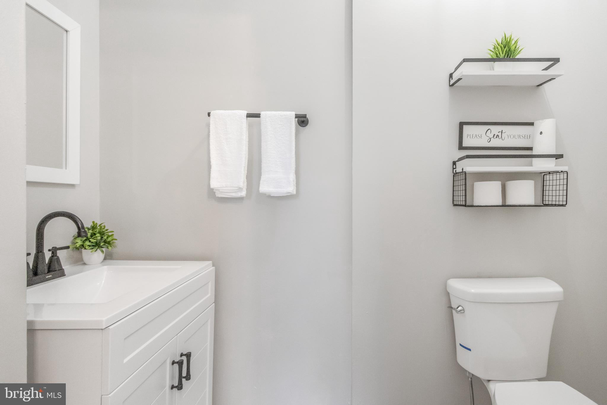 1235 North Bond Street Baltimore, MD 21213 - Photo 6 of 19 a bathroom with a sink toilet and