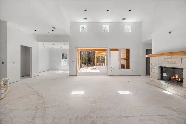 a large white kitchen with a large window