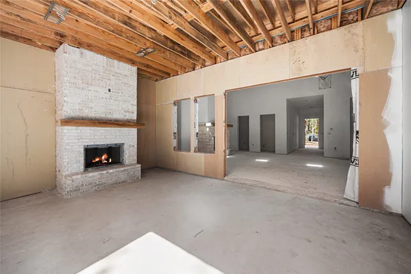 a view of an empty room with a fireplace