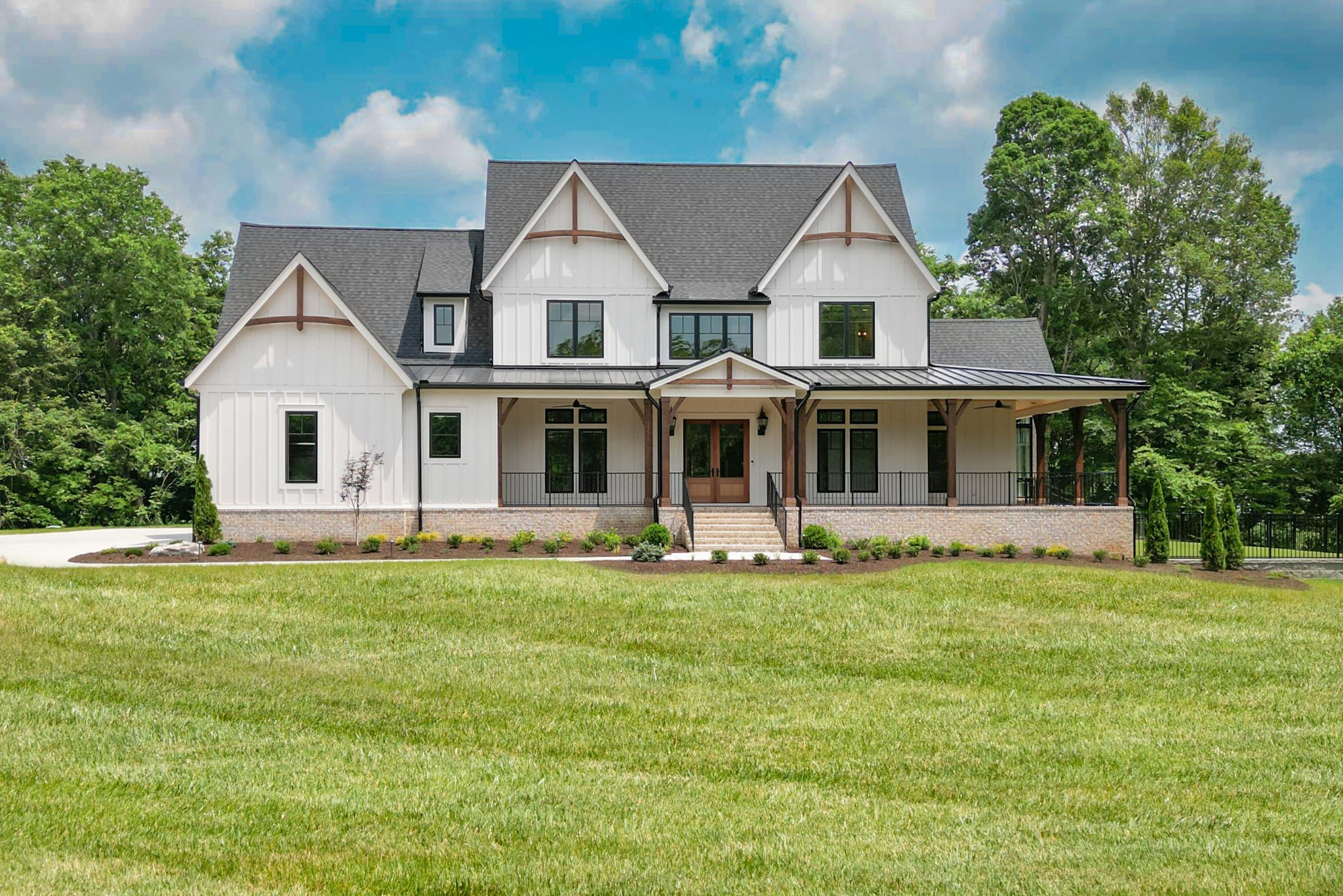 1442 Coleman Road Franklin, TN 37064 - Photo 1 of 63 a front view of a house with a garden