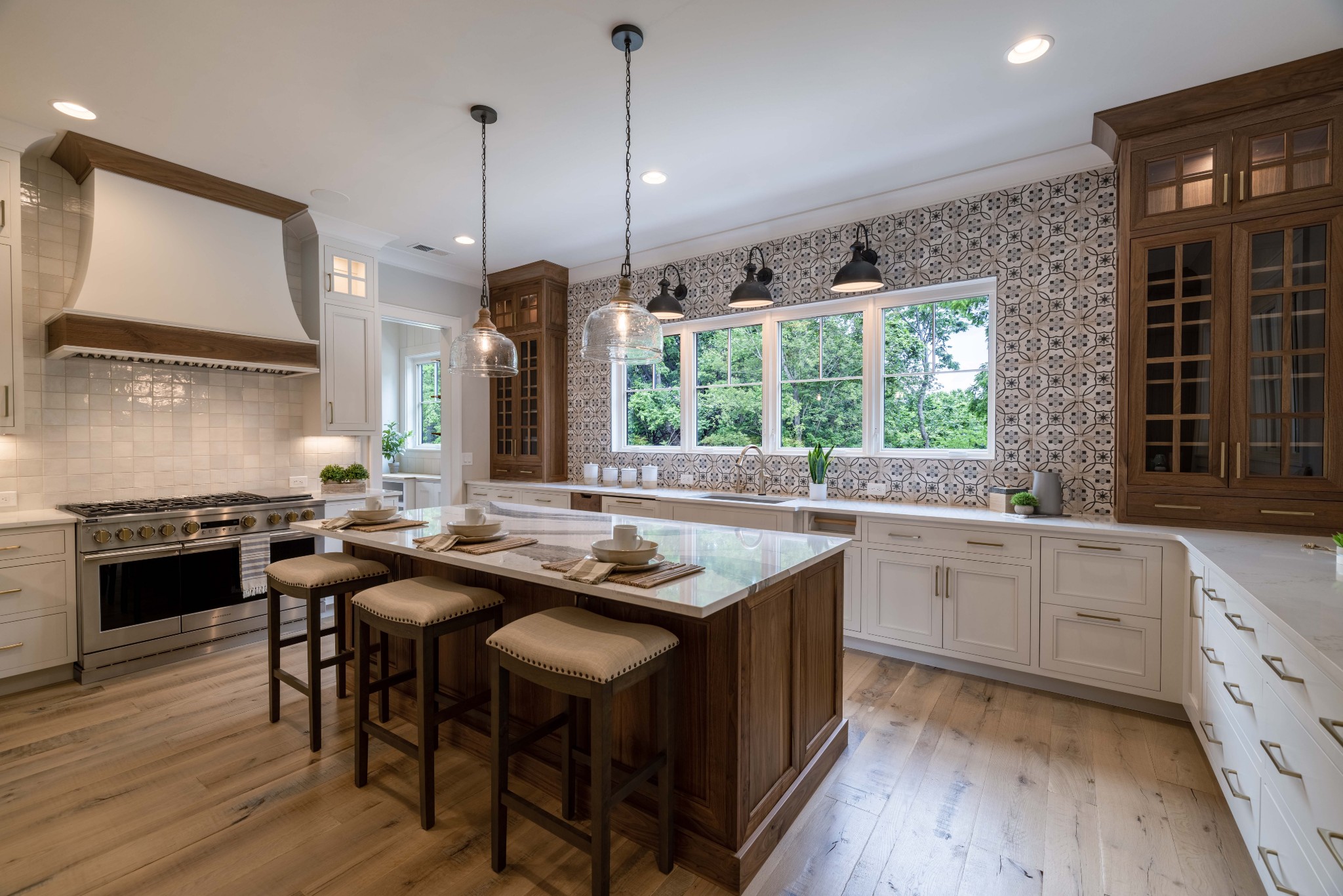 1442 Coleman Road Franklin, TN 37064 - Photo 20 of 63 a kitchen with stainless steel appliances granite countertop wooden floors stove sink and cabinets