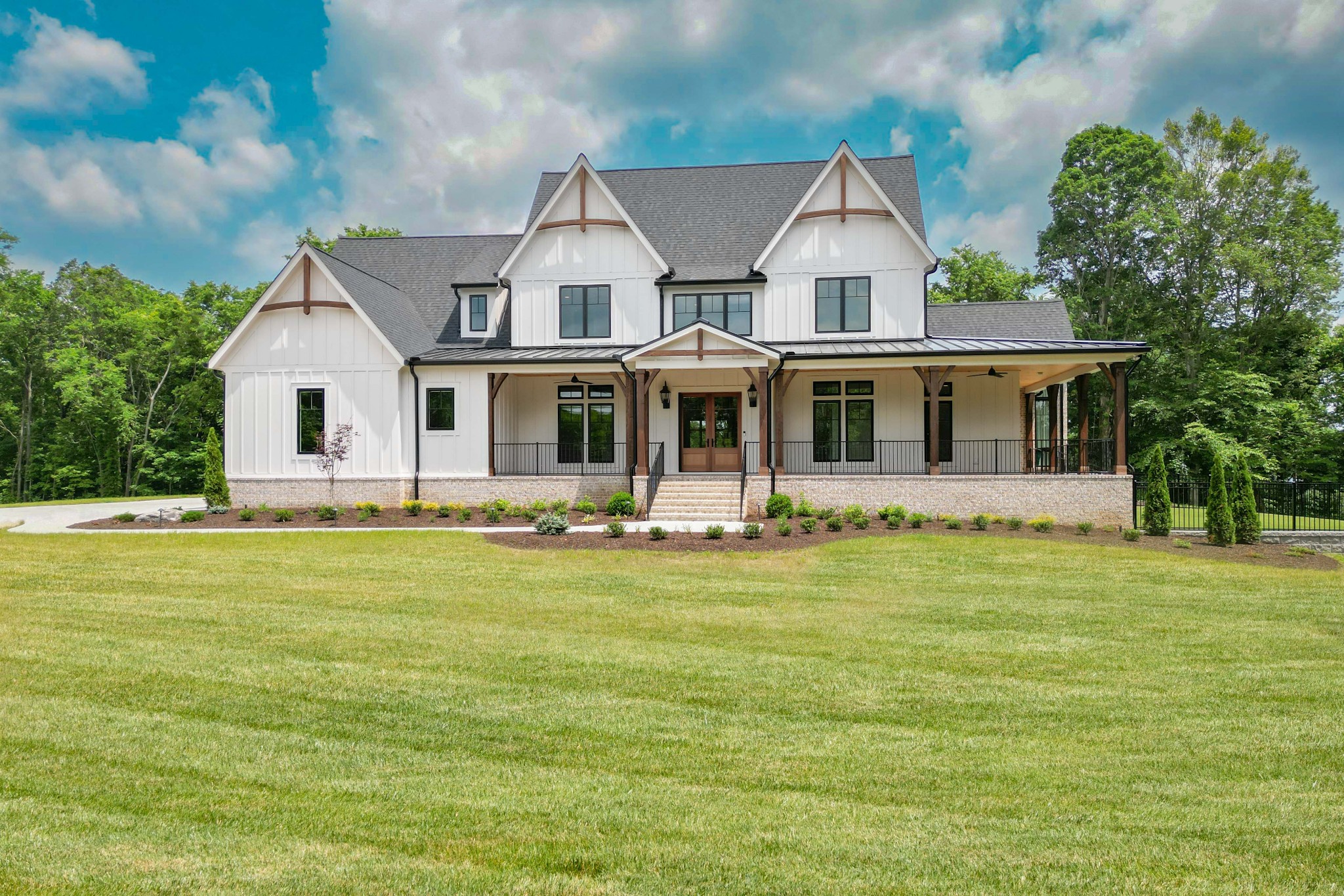 1442 Coleman Road Franklin, TN 37064 - Photo 2 of 63 a front view of a house with a garden