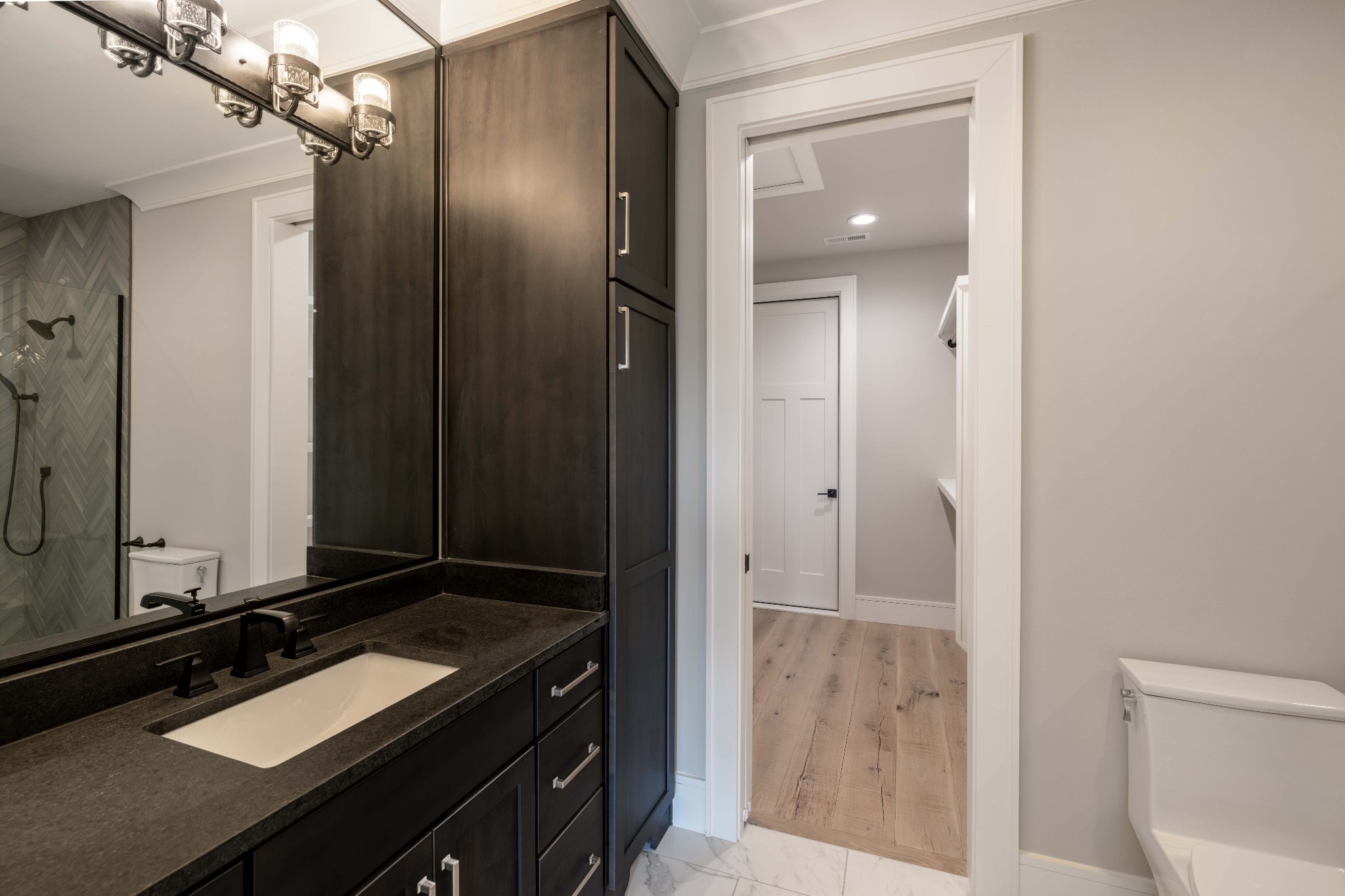 1442 Coleman Road Franklin, TN 37064 - Photo 45 of 63 a room with a mirror and a sink