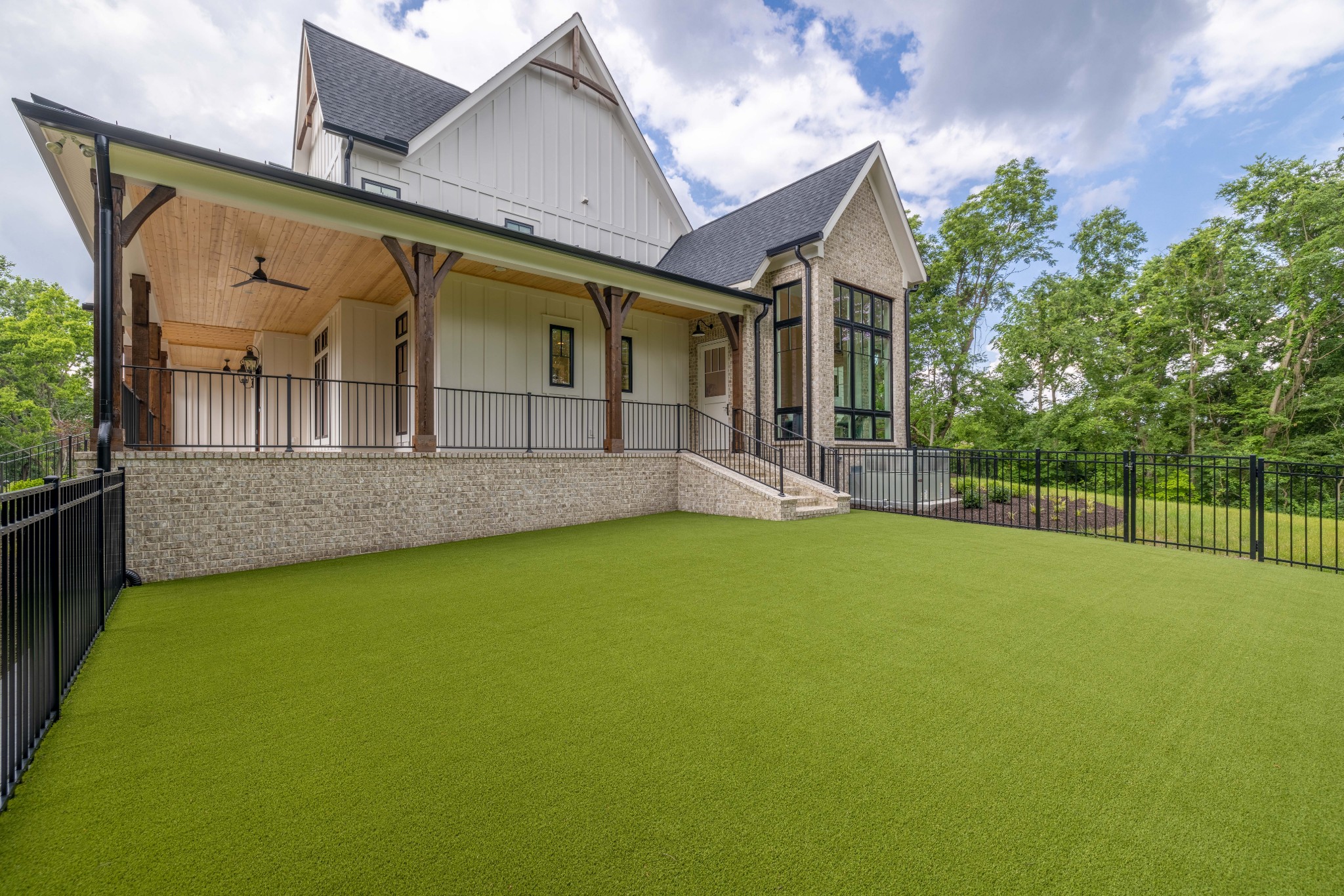 1442 Coleman Road Franklin, TN 37064 - Photo 50 of 63 a view of a house with a backyard and porch