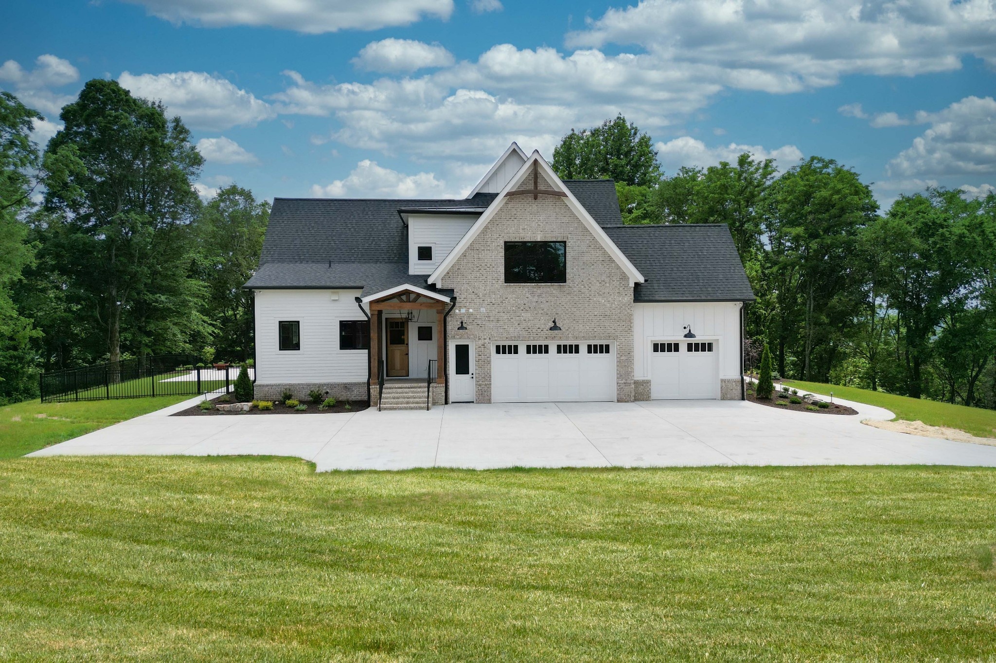 1442 Coleman Road Franklin, TN 37064 - Photo 62 of 63 a front view of a house with a yard and garage