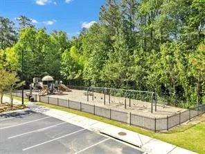 a view of a swimming pool with a yard