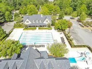 an aerial view of a house with a swimming pool