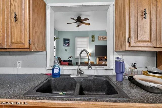 a kitchen with a sink and cabinets