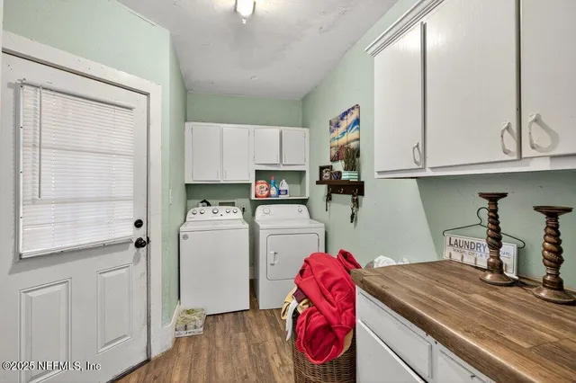 a kitchen with a refrigerator and a stove top oven