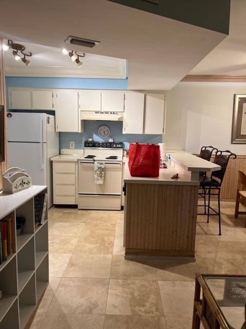1605 Highway 1, Unit E203 Jupiter, FL 33477 - Photo 15 of 28 a living room with stainless steel appliances kitchen island granite countertop a sink and cabinets