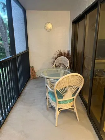 a view of balcony with furniture