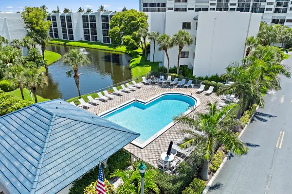 an aerial view of a house with yard swimming pool and outdoor seating