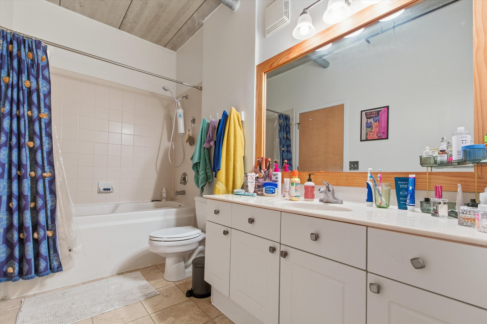 1440 South Michigan Avenue, Unit 415 Chicago, IL 60605 - Photo 14 of 18 a bathroom with a sink mirror and toilet