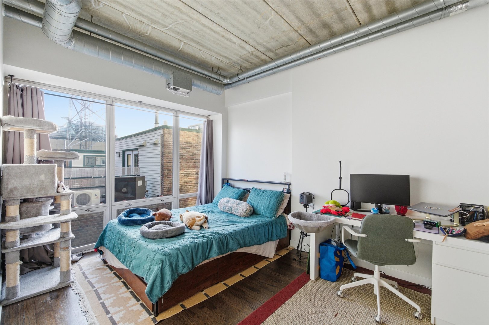 1440 South Michigan Avenue, Unit 415 Chicago, IL 60605 - Photo 9 of 18 a bedroom with furniture and a flat screen tv