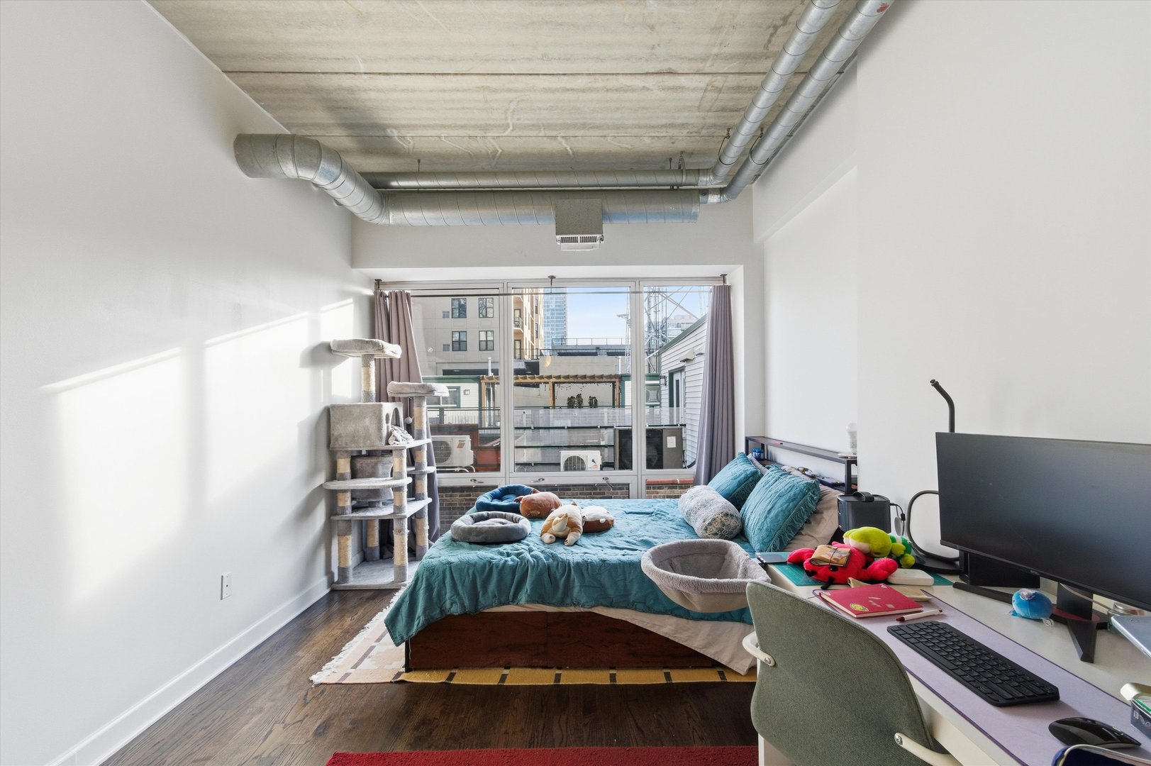 1440 South Michigan Avenue, Unit 415 Chicago, IL 60605 - Photo 10 of 18 a room with furniture and a flat screen tv