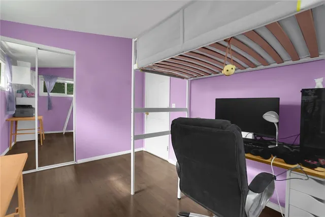 a dining room with furniture and a floor to ceiling window