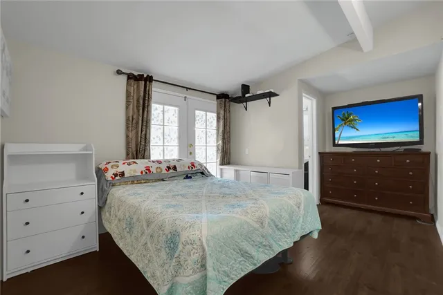 a bedroom with a bed and a dresser