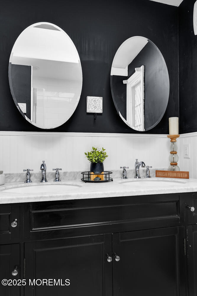 21 Buttonwood Drive Shrewsbury, NJ 07702 - Photo 39 of 86 a bathroom with a sink and a mirror