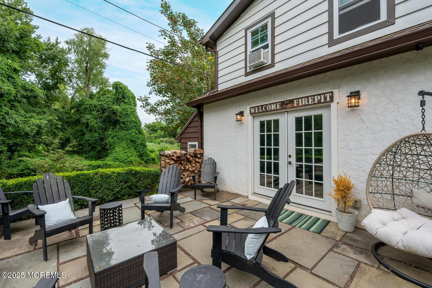 21 Buttonwood Drive Shrewsbury, NJ 07702 - Photo 57 of 86 a view of a patio with couple of chairs and a fire pit