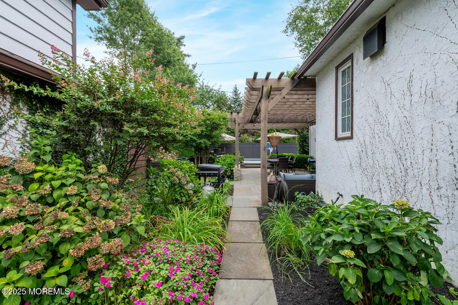 21 Buttonwood Drive Shrewsbury, NJ 07702 - Photo 59 of 86 a backyard of a house with lots of green space and trees