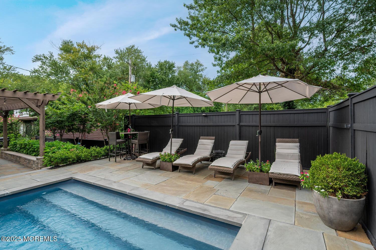 21 Buttonwood Drive Shrewsbury, NJ 07702 - Photo 65 of 86 a view of backyard with plants and outdoor seating
