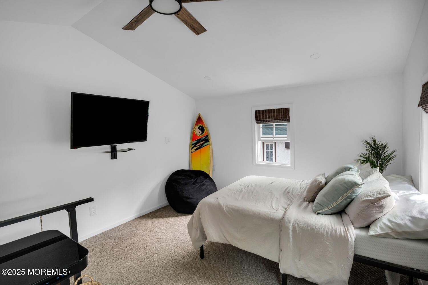 21 Buttonwood Drive Shrewsbury, NJ 07702 - Photo 85 of 86 a bedroom with a bed a flat screen tv and a potted plant