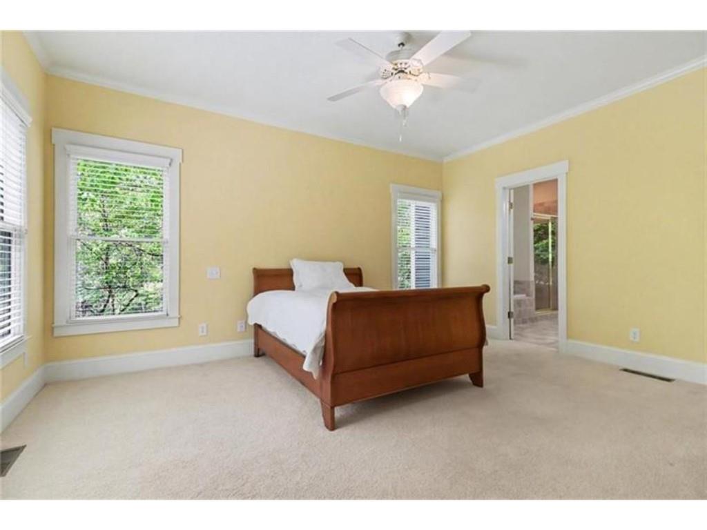 53 Pinto Place Jasper, GA 30143 - Photo 47 of 62 a spacious bedroom with a bed a window and a chandelier