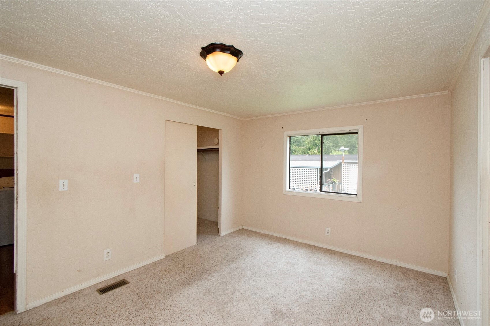 90 Baywood Village Road, Unit 34 Sequim, WA 98382 - Photo 25 of 40 an empty room with windows