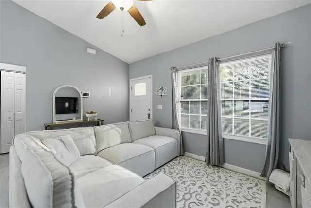 a living room with furniture and a window