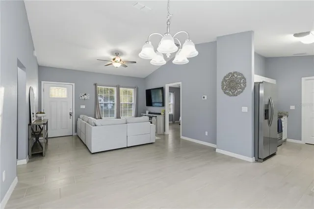 a view of living room with furniture and chandelier