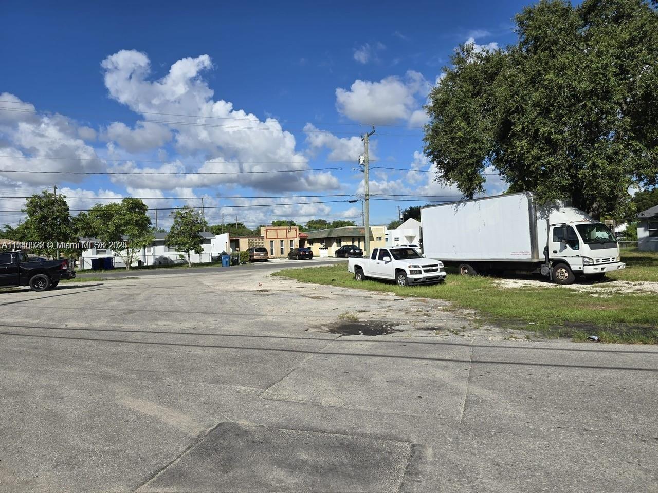 628 Northwest 22nd Road Fort Lauderdale, FL 33311 - Photo 5 of 8 a view of a white house with a yard