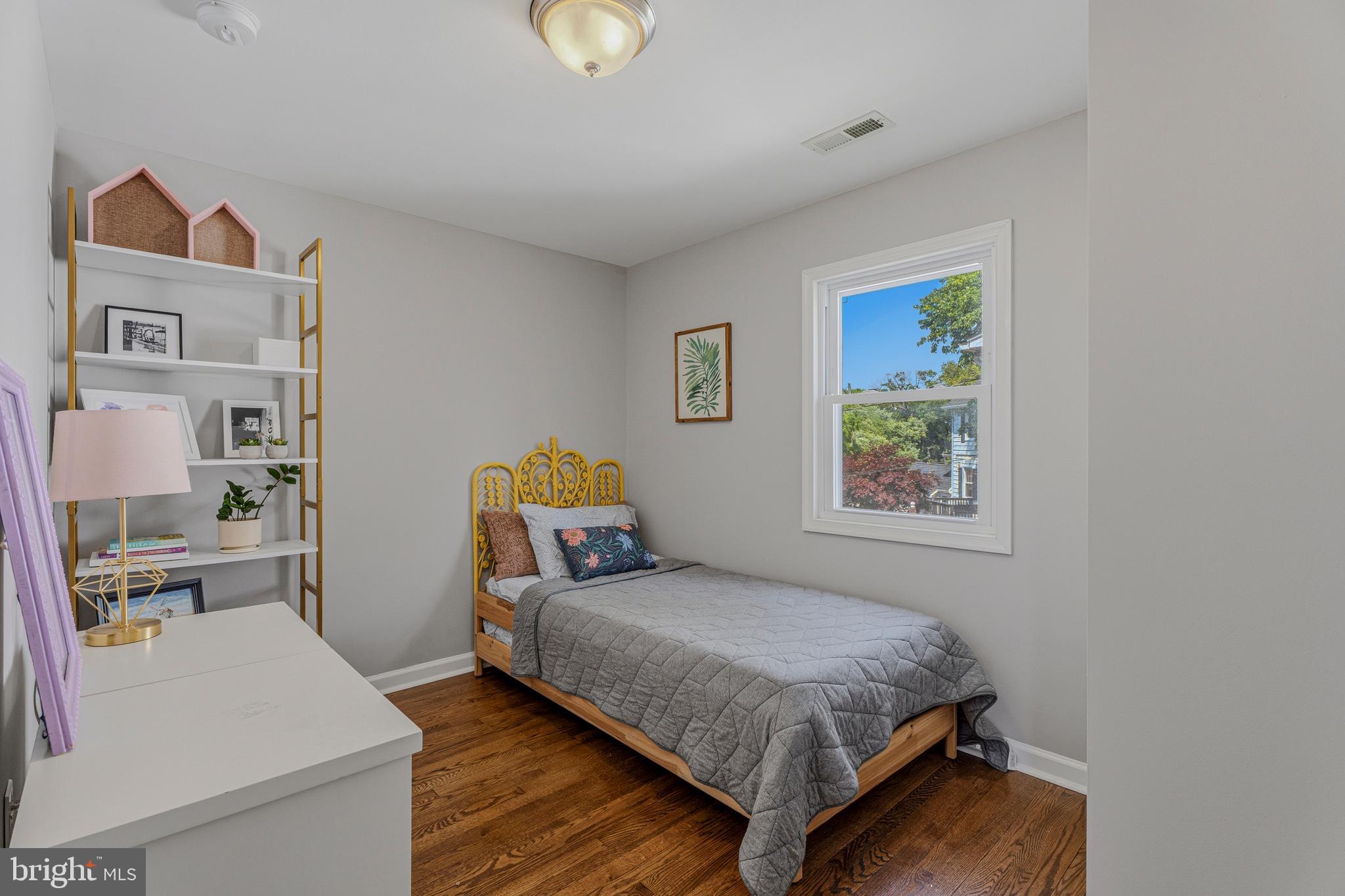 506 Brook Road Baltimore, MD 21286 - Photo 27 of 56 a bedroom with a bed and wooden floor