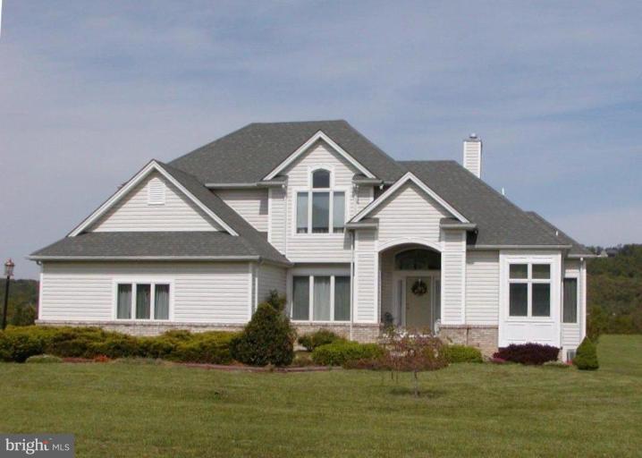 3897 Apple Pie Ridge Road Winchester, VA 22603 - Photo 1 of 10 a front view of a house with a yard