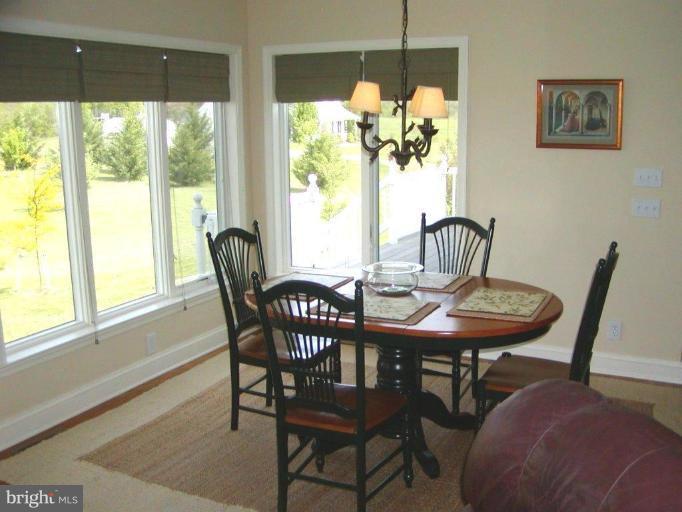 3897 Apple Pie Ridge Road Winchester, VA 22603 - Photo 9 of 10 a view of a dining room with furniture window and outside view