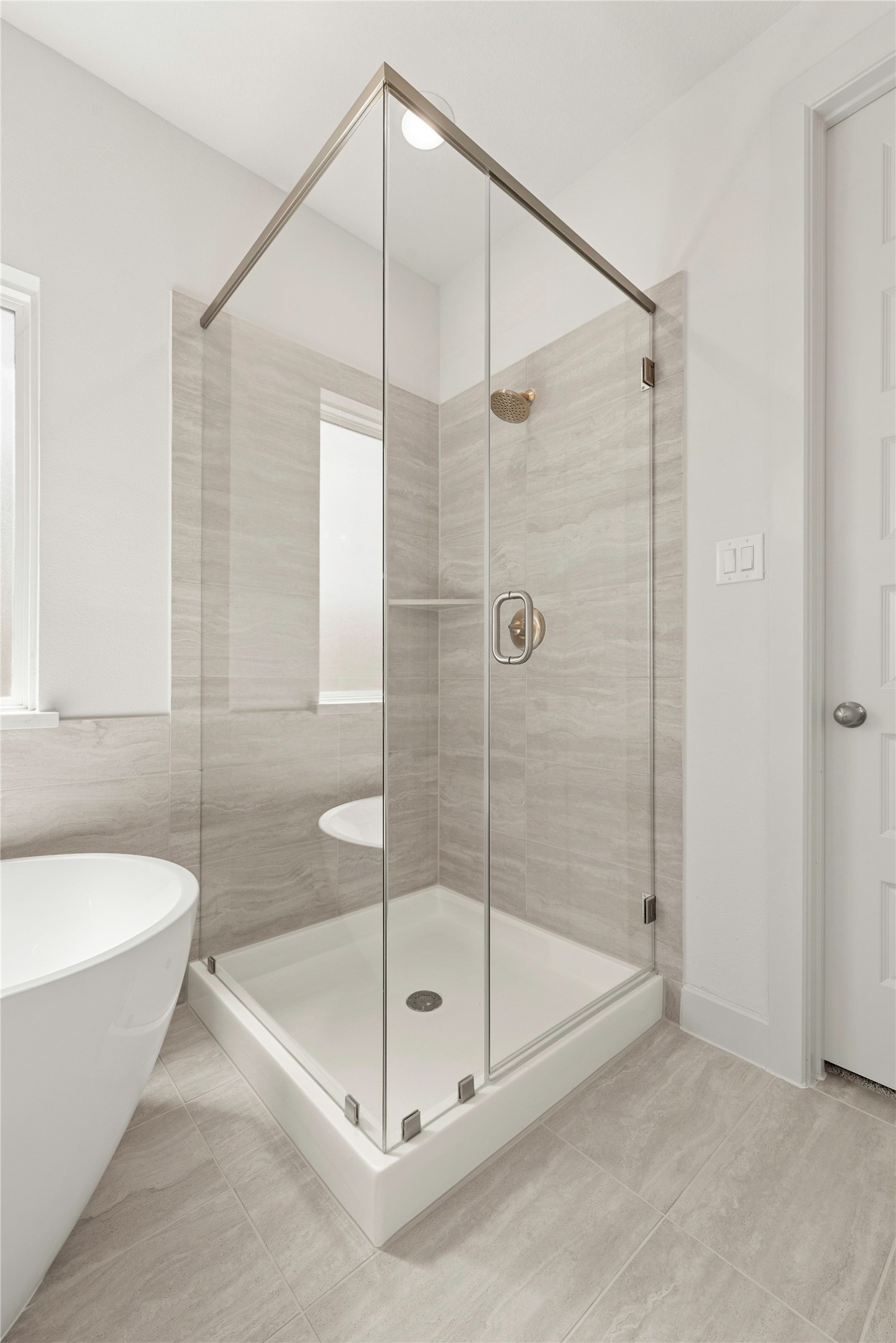 4403 Ruby Gdn Court Fulshear, TX 77441 - Photo 11 of 28 a bathroom with a bathtub and a shower