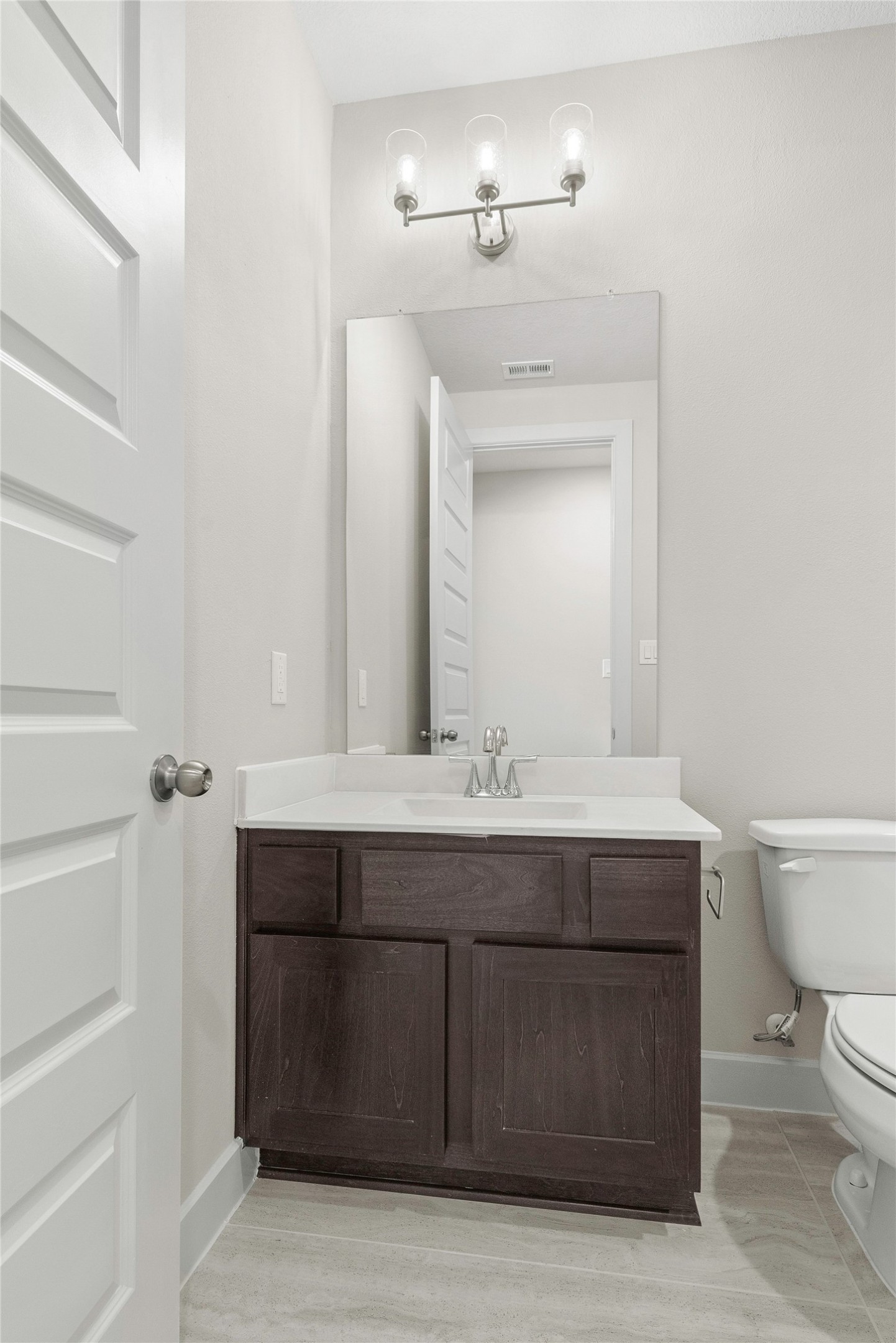 4403 Ruby Gdn Court Fulshear, TX 77441 - Photo 13 of 28 a bathroom with a sink vanity and toilet