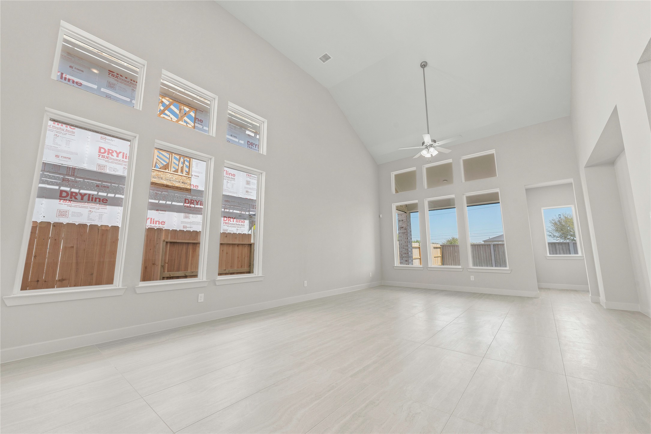 4403 Ruby Gdn Court Fulshear, TX 77441 - Photo 4 of 28 a view of an empty room with a window and wooden floor