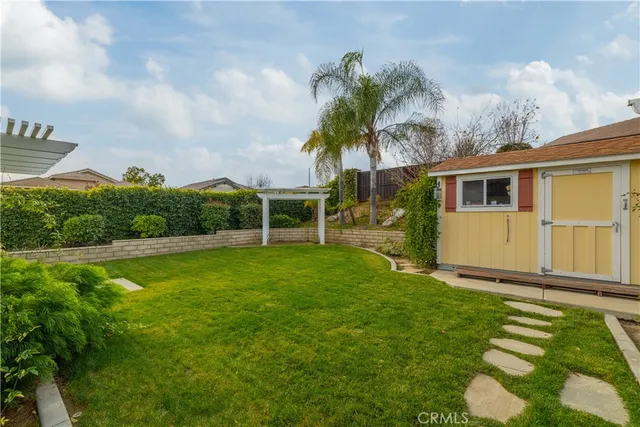 a front view of house with a garden and pathway