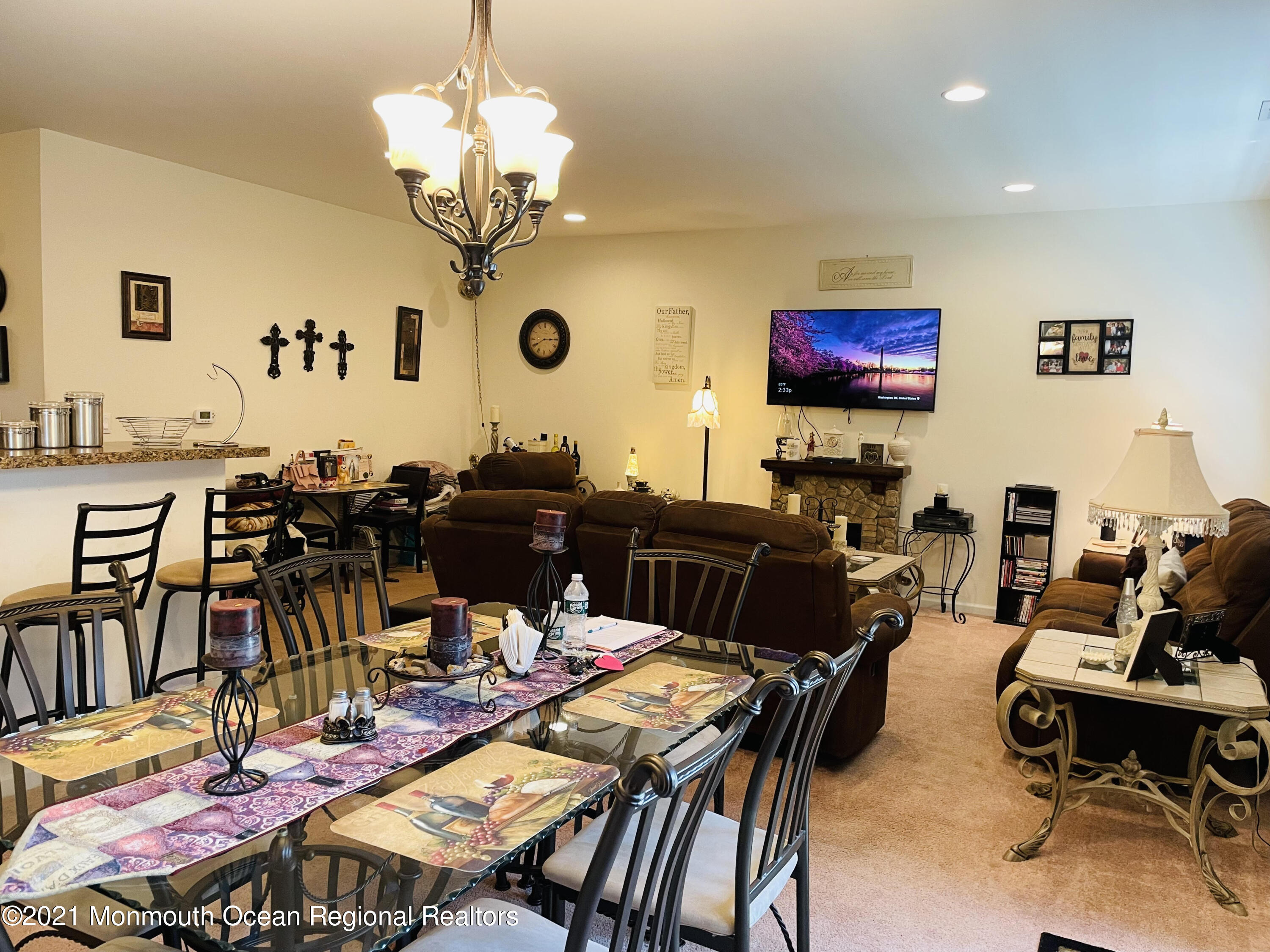 64 Rockingham Way Manchester Township, NJ 08759 - Photo 14 of 41 a view of a dining room with furniture and a chandelier