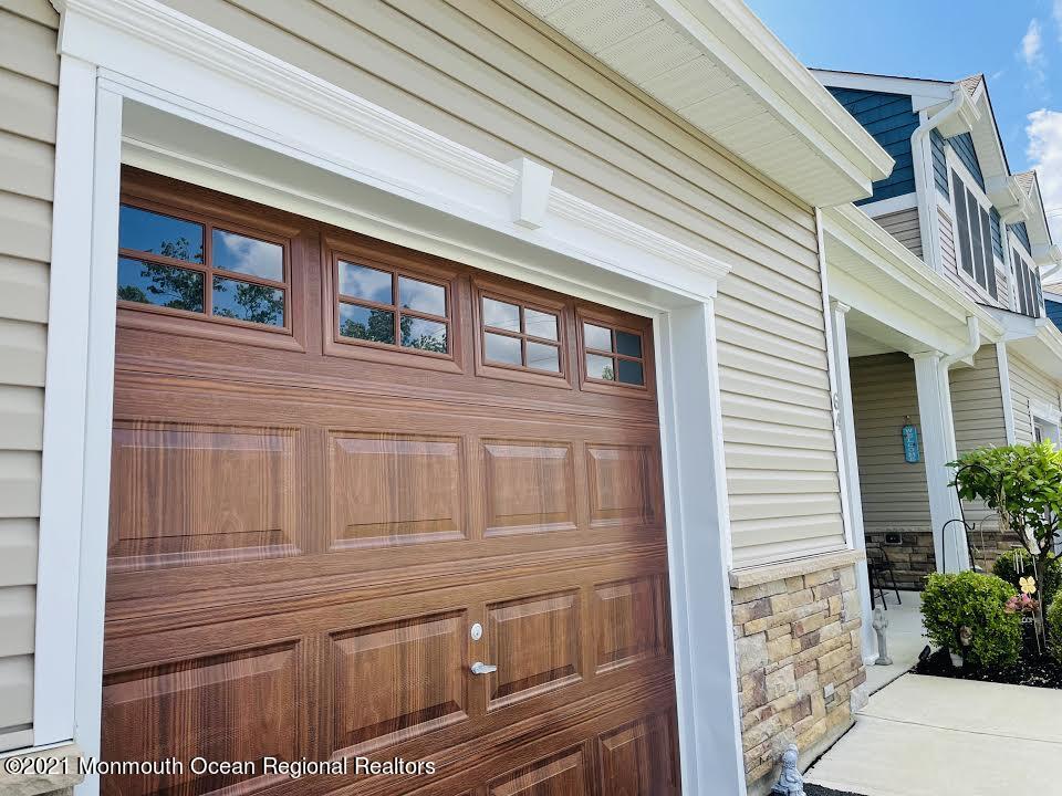 64 Rockingham Way Manchester Township, NJ 08759 - Photo 3 of 41 a front view of a house with a large window