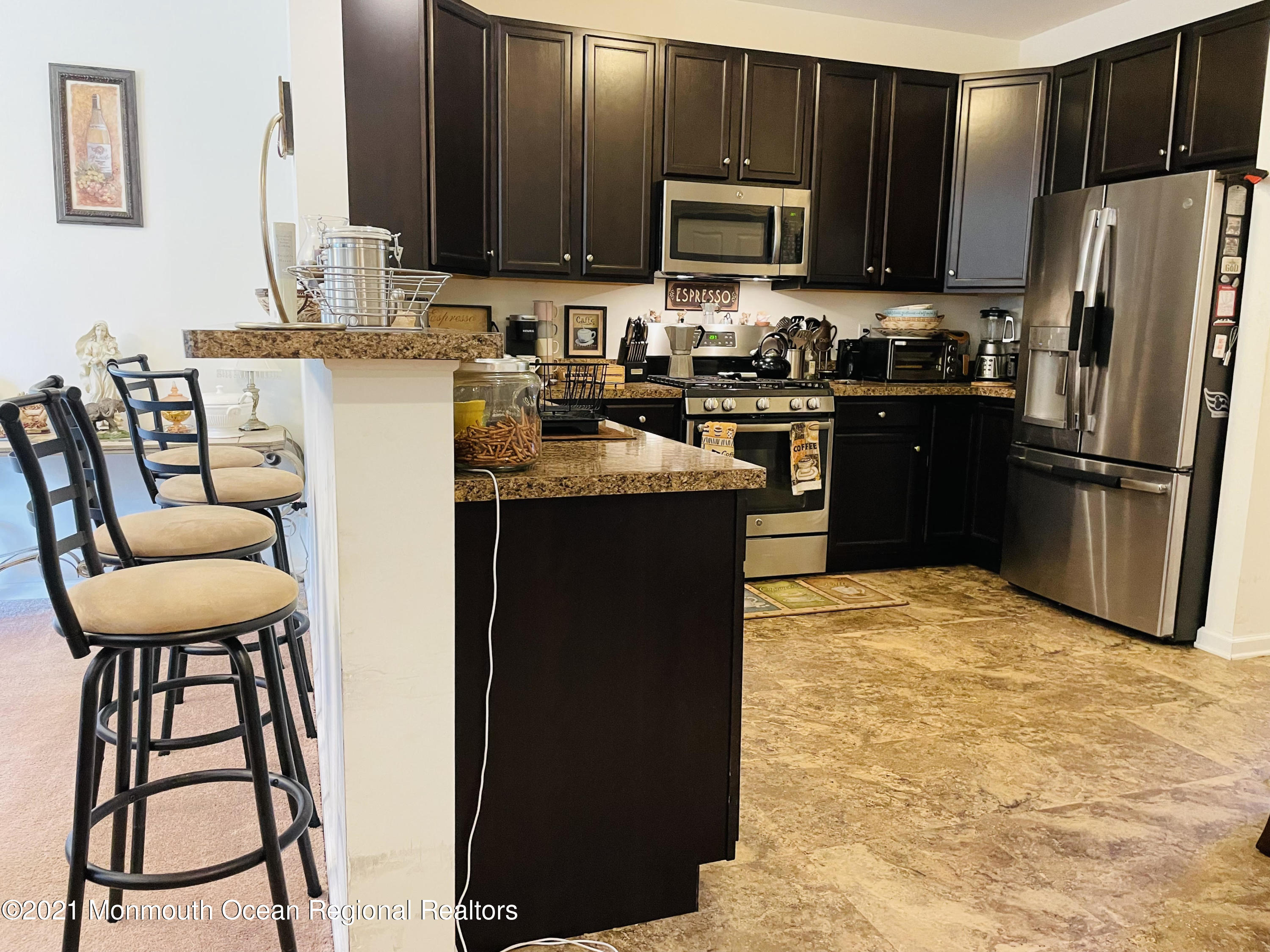 64 Rockingham Way Manchester Township, NJ 08759 - Photo 8 of 41 a kitchen with stainless steel appliances granite countertop a refrigerator stove top oven a sink and dishwasher