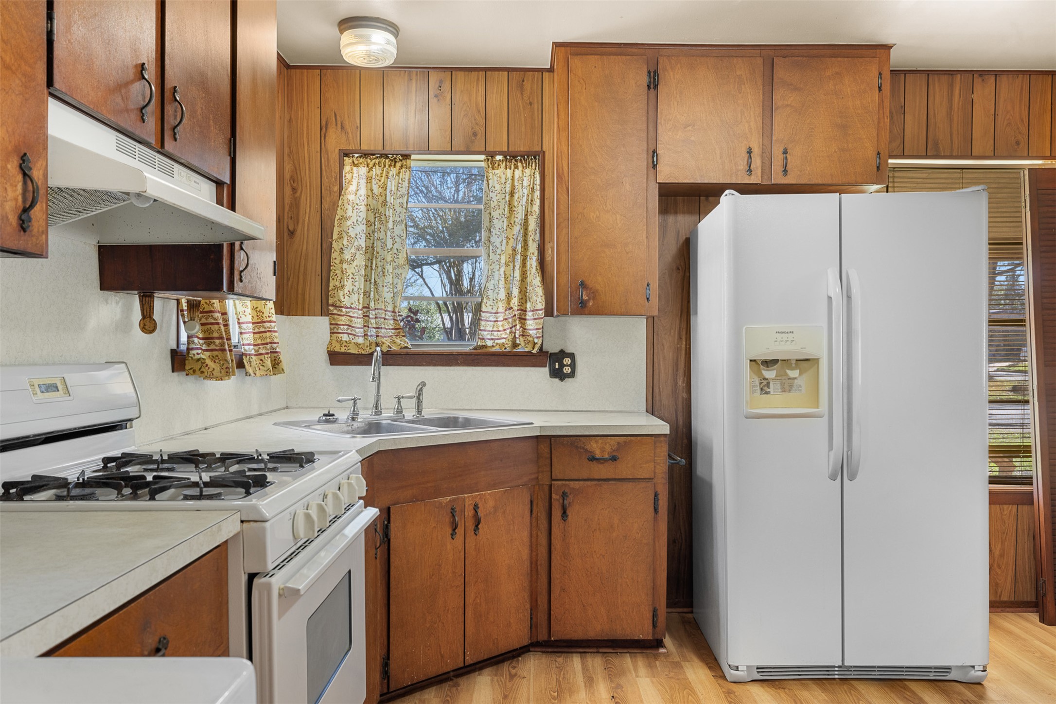 809 Main Street Lexington, TX 78947 - Photo 12 of 23 a kitchen with a refrigerator sink and stove