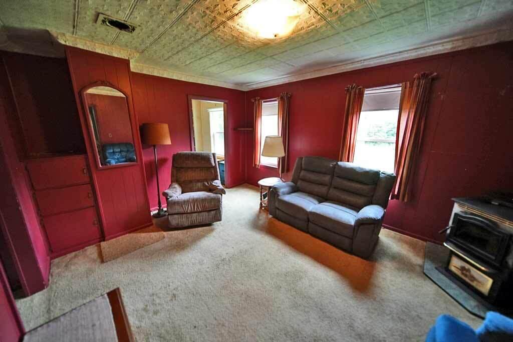 235 Burton Road Linneus, ME 04730 - Photo 41 of 105 living-room-tin-ceiling