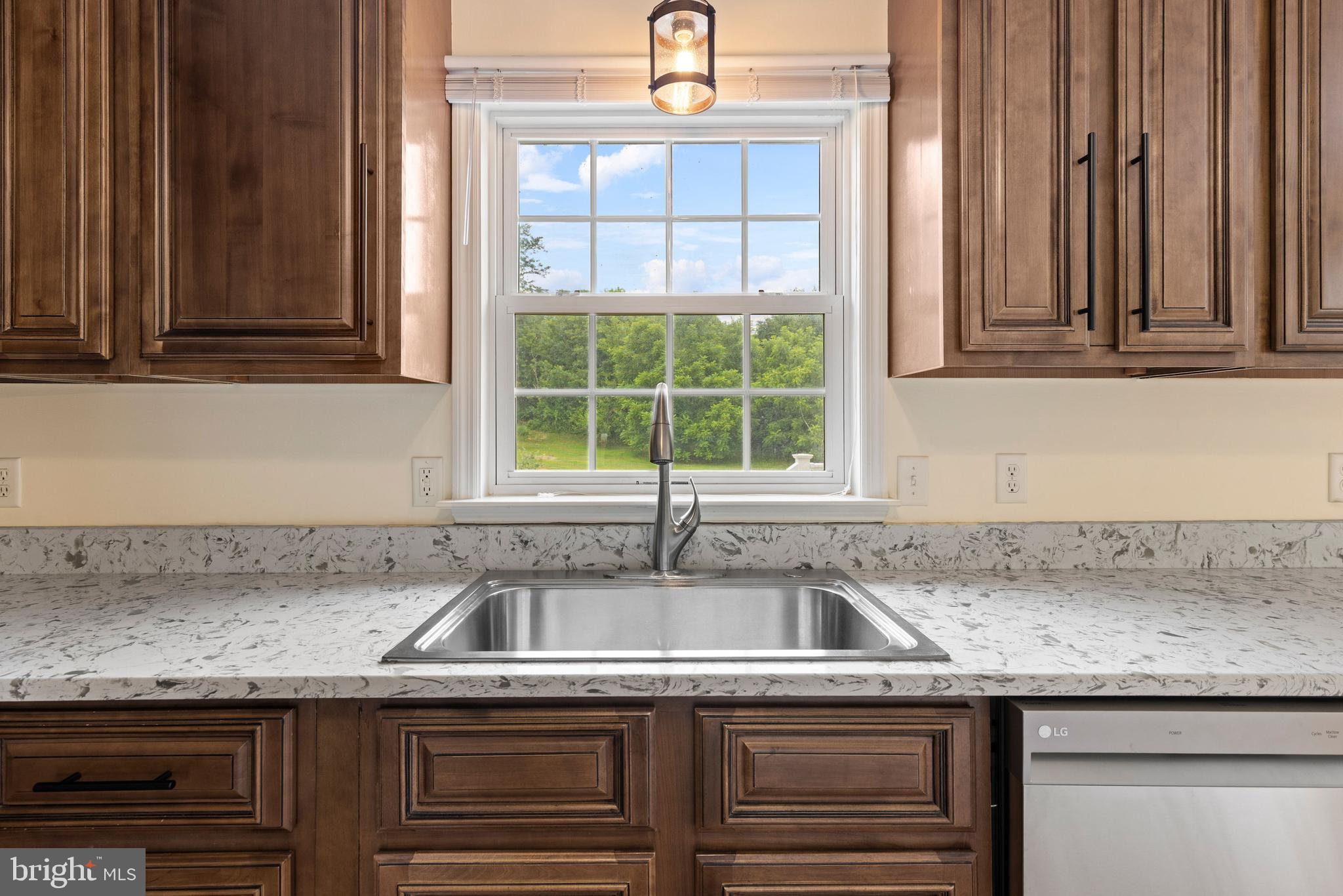 67 Merry Knoll Court Conowingo, MD 21918 - Photo 11 of 50 a kitchen with granite countertop a sink and a window