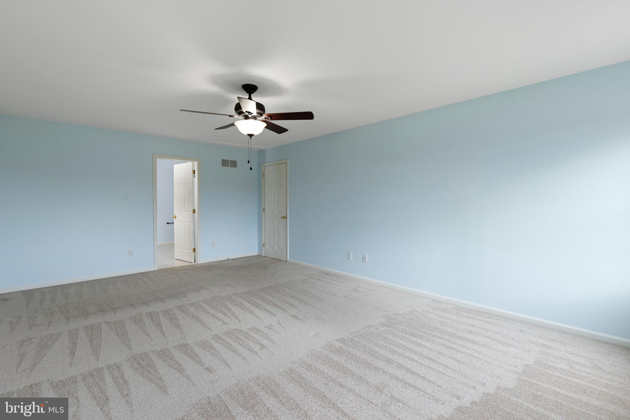 67 Merry Knoll Court Conowingo, MD 21918 - Photo 20 of 50 a view of an empty room with a ceiling fan